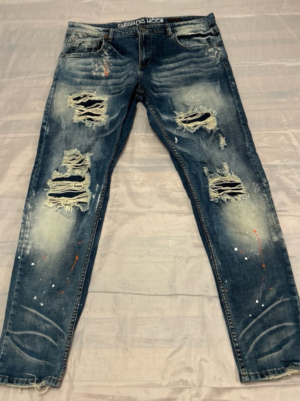 Men's Skinny Distressed Blue Jeans with Paint Splatter